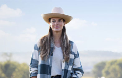 Dairy Farmers of America female farmer-owner wearing a cowboy hat