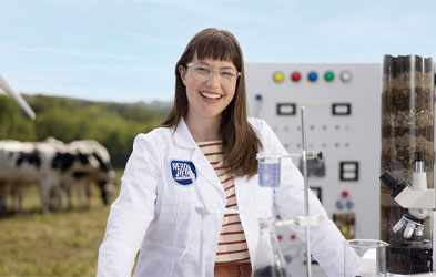 Dairy Farmers of America female innovator wearing a long white coat